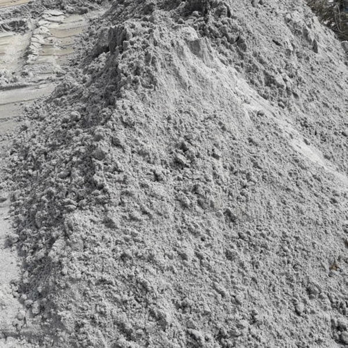 Ravi sand ret grey bulk pile — river sand trolley supply Lahore Punjab